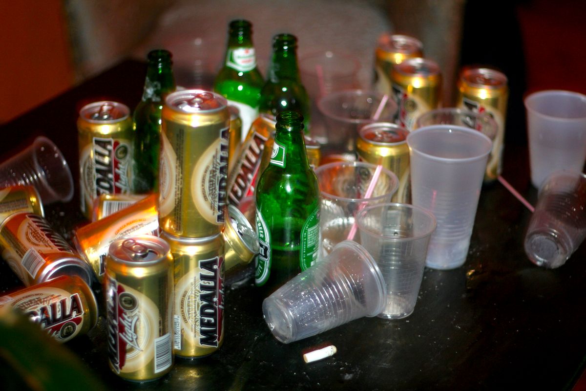 Empty Medalla beer cans and bottles on a table in San Juan, Puerto Rico